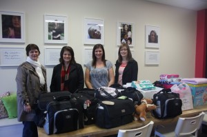 Babes Project volunteers and nappy bags for clients.