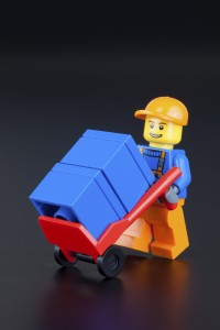 LEGO worker minifigure with hand truck