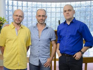 Anglican minister David Ould (right), with gay couple Michael Barnett and Gregory Storer. 