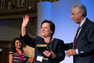 In honor of martyred Rev. Tateos Michaelian, his widow Juliet is presented with the first copy of the whole Bible in modern Persian.