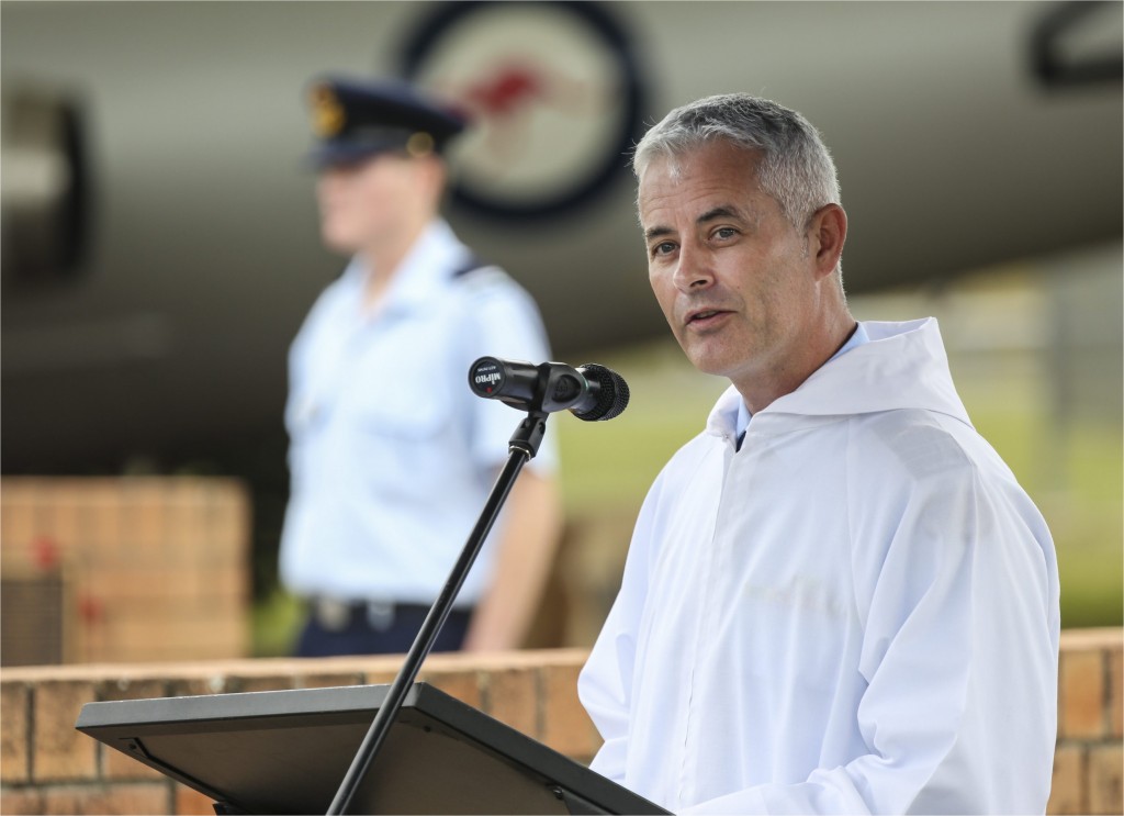 Chaplain Kevin O'Sullivan provides a spiritual reflection during a Commemorative Service.  © Commonwealth of Australia, Department of Defence 