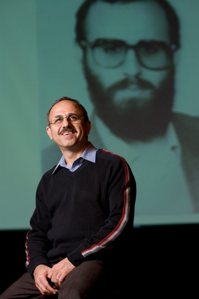 Daniel Shayesteh, 50, spoke to students at Lexington Christian Academy about his life as a radical Muslim political leader in Iran during the Iranian Revolution on Thursday March 1, 2007. He eventually became a Christian and now speaks about ways Christians can reach out to Muslims. Projected on a screen behind him is a photo of him during the second year of the Iranian Revolution. Andy Olsen