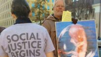 Graham Preston protests outside a Hobart abortion clinic