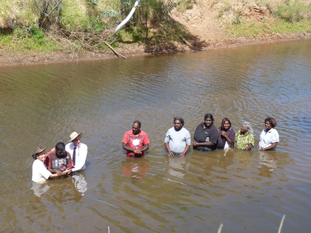 The baptism of seven people in the McLaren River near Mungkarta