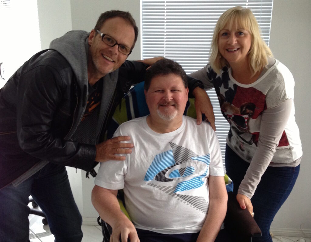 Phil Camden and his wife Lenore, visiting a friend who also has Motor Neurone Disease.
