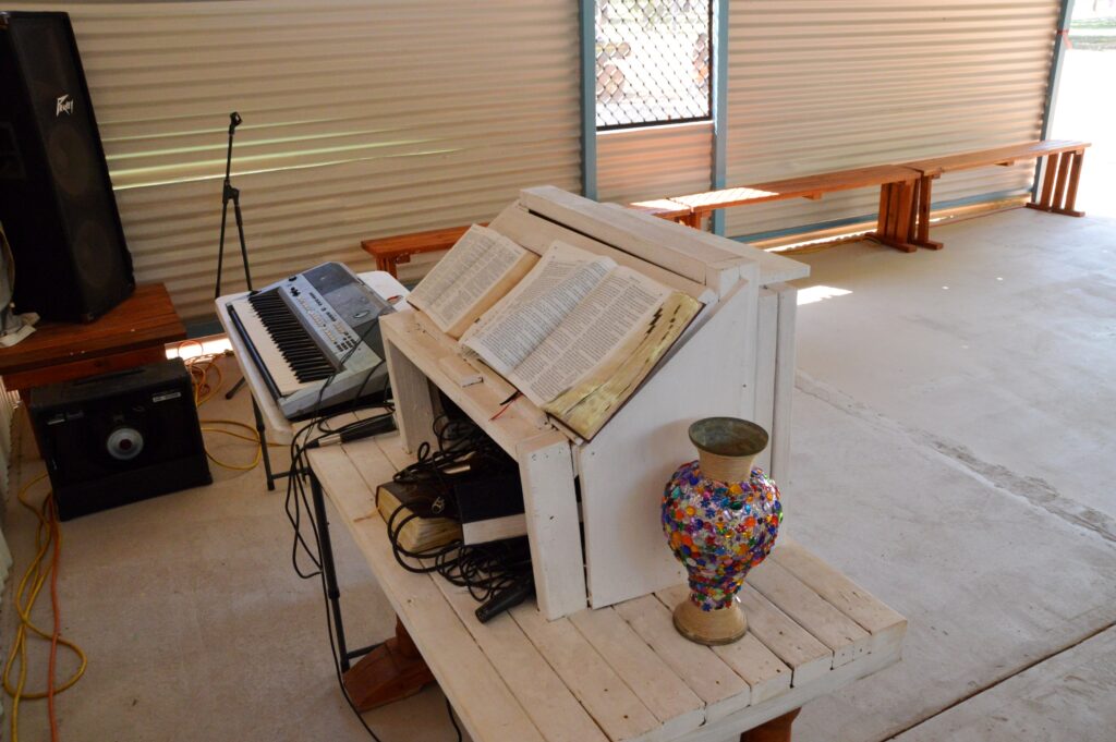 Every piece of furniture in the church is made from hand, including the pulpit, on which proudly rests a bible translated into Kriol.