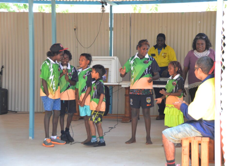 Students from Manyallaluk School mark the official opening of the tiny community’s new place of worship with a Christian rap, which was taught to them by the men of the congregation.