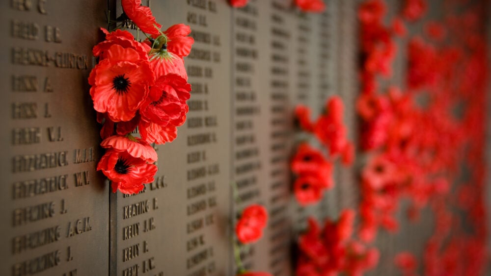 Red poppies line the Wall of Honour at the Australian War Memorial in Canberra