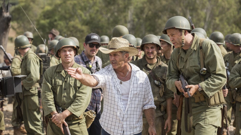 Mel Gibson directs actors on the set of Hacksaw Ridge