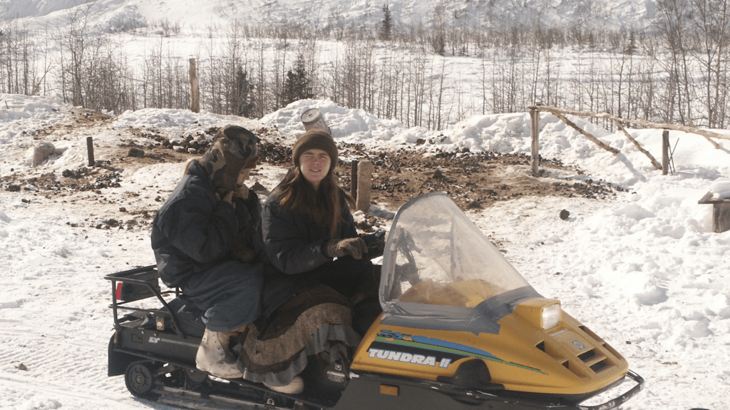 Elishaba and one of her sisters on a snow plough