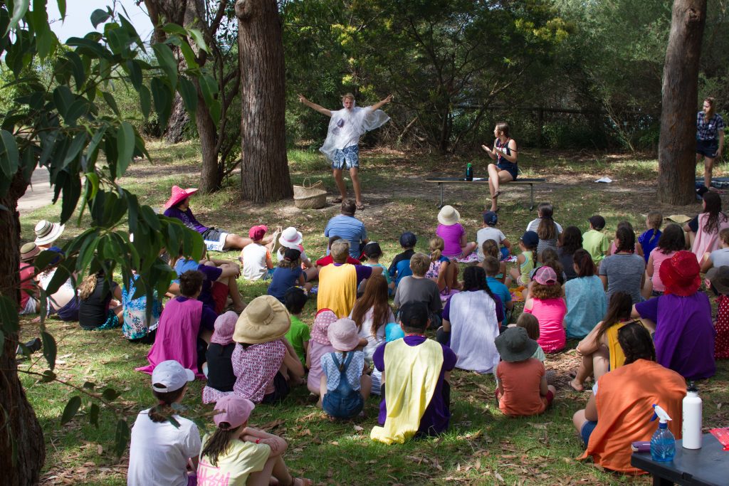 Children watch a drama at Huskisson Beach Mission on the NSW South Coast