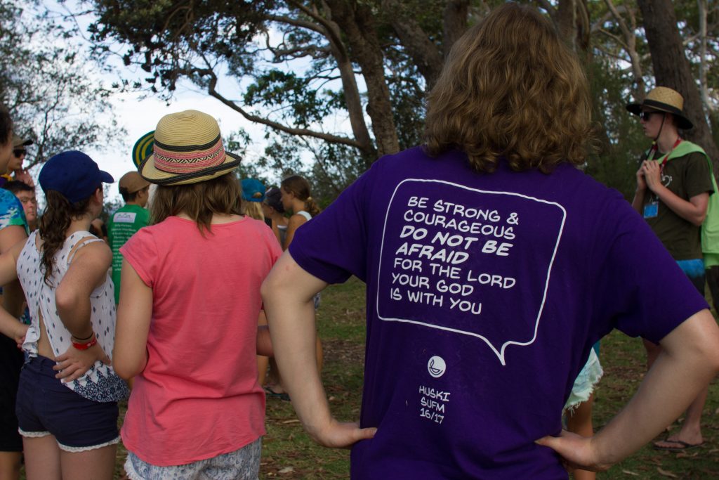 Team members wear tee shirts that proclaim God's word