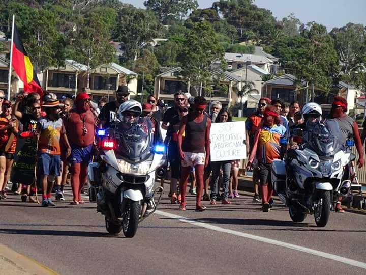 Clinton Pryor and supporters march over the Joy Baluch Bridge today