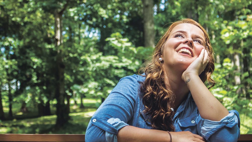 Woman sitting at bench