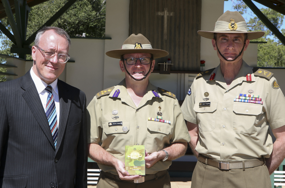 CEO of the Bible Society Dr Greg Clarke with Director General Chaplaincy - Army BRIG Darren Jaensch (centre) and Chief of Army LTGEN Angus Campbell, with the new-look camouflage Army Bible.