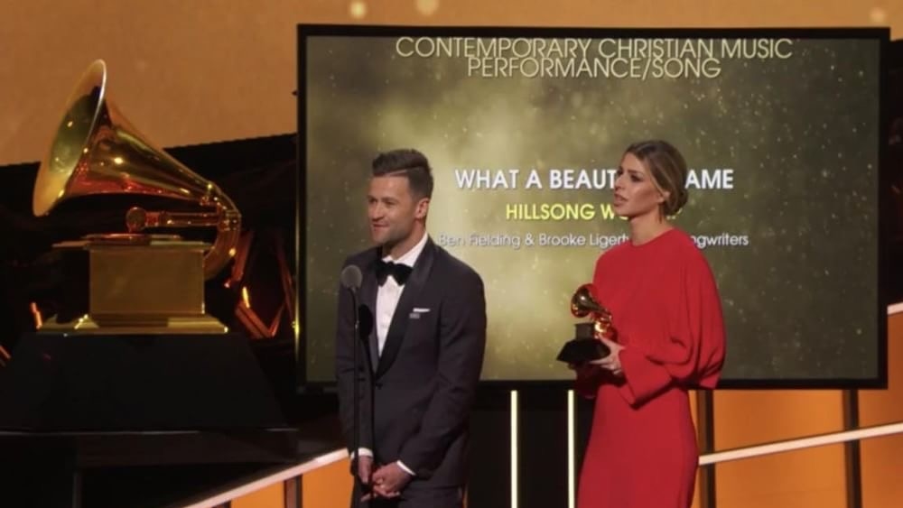 Brooke Ligertwood and Ben Fielding from Hillsong Worship accept their Grammy Award.
