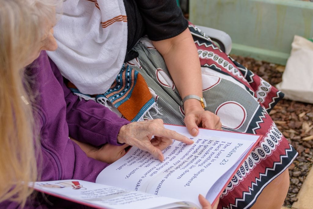 Thelma reads her Hymn and Bible Book