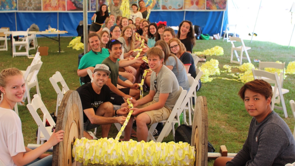 Ben Thompson from Beachside Baptist with young people creating the world's longest prayer chain