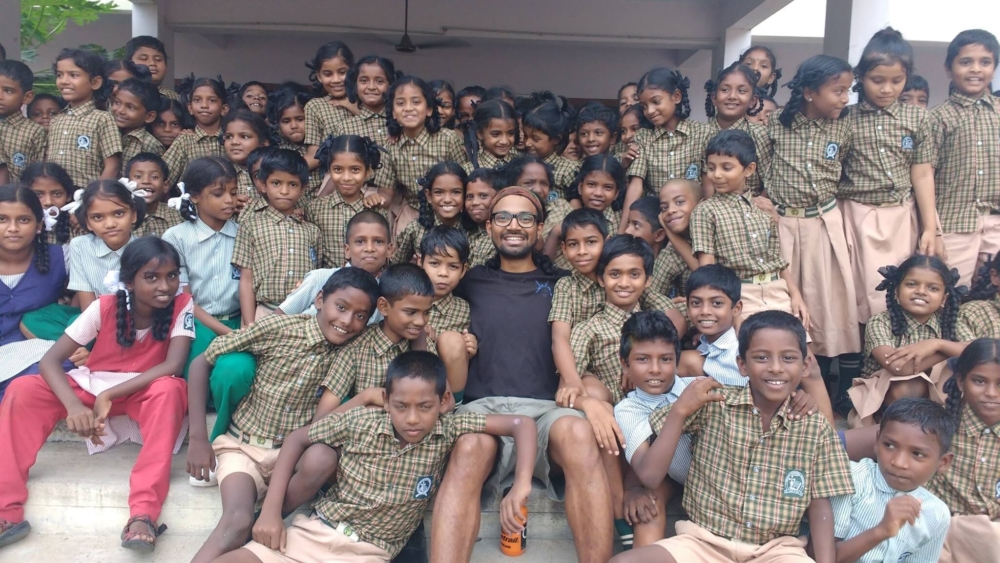 Naresh Kumar with schoolboys in his native Chennai