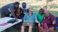 Paul Eckert (middle) with Pitjantjatjara local Bible translators working together in Ernabella (Pukatja).