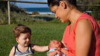 Jovina James with her son Teddy in her arms