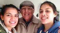 Claudia, aged 16, with grandfather Geoff Horne and her sister Francesca, 14.