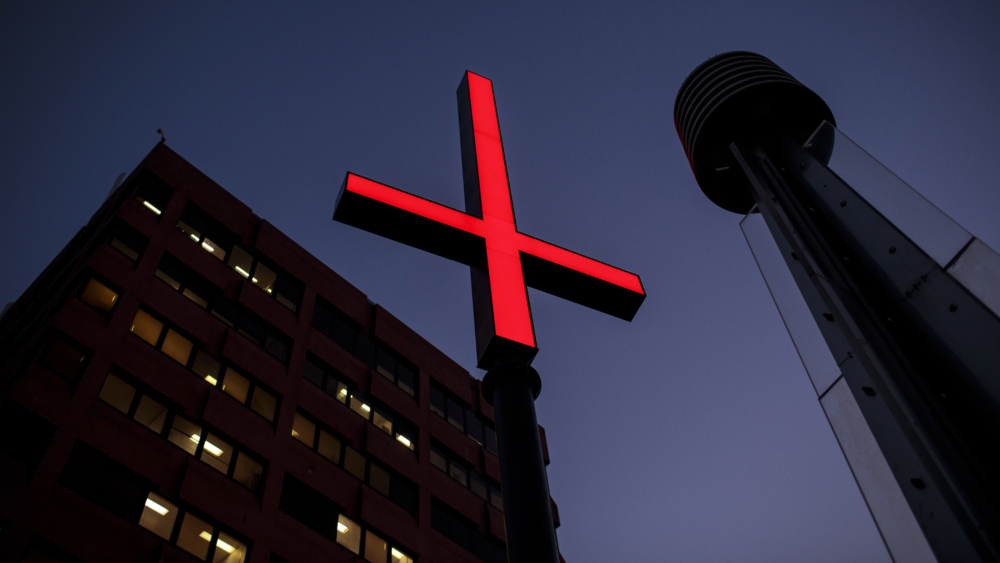 It's not Christians who should be offended by the bright-red inverted crosses, argues Michael Jensen.