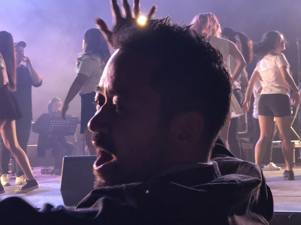 Steve Chong celebrates in worship at Rice Rally, Sydney, August 18