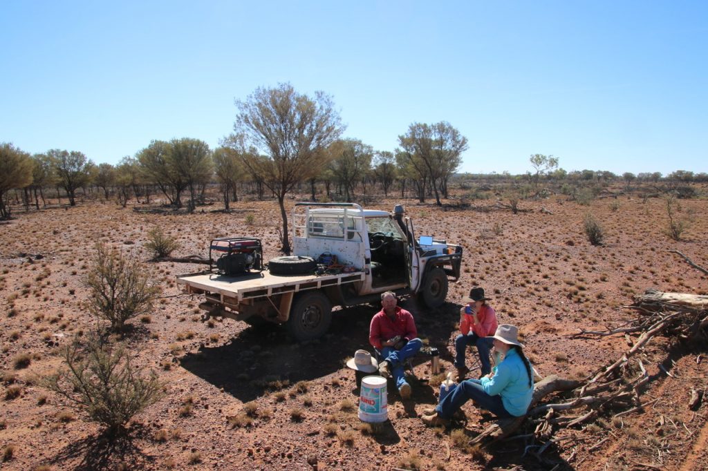 Skye (in blue) with her dad and sister having dinner while out working on Barbara Plains.