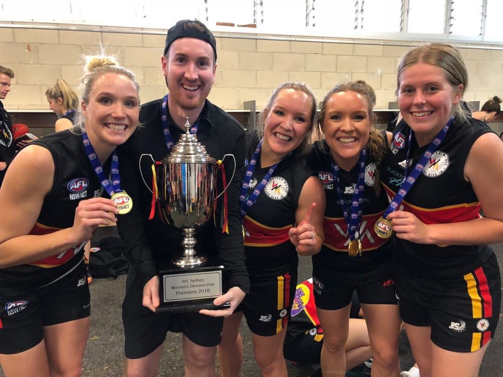 Leighton Corr with the GWS women's team that he coached to a Premiership win in 2018. 