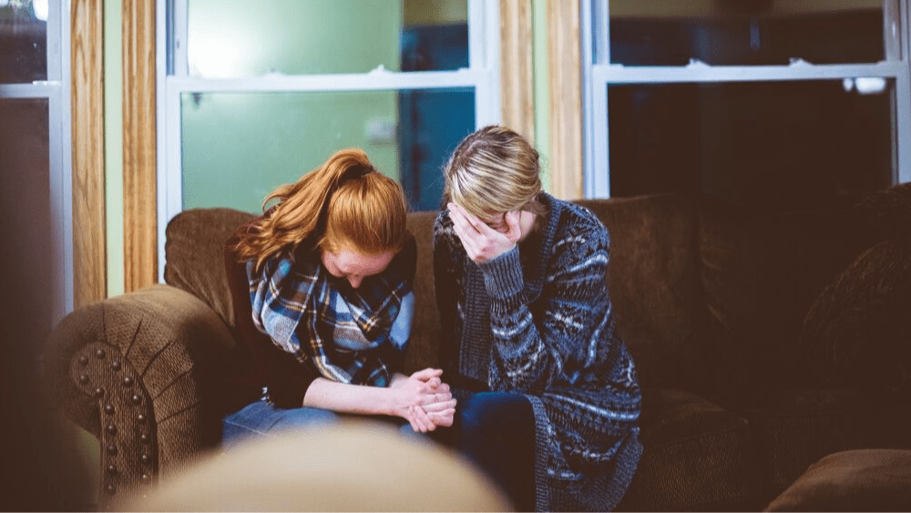 Two women praying