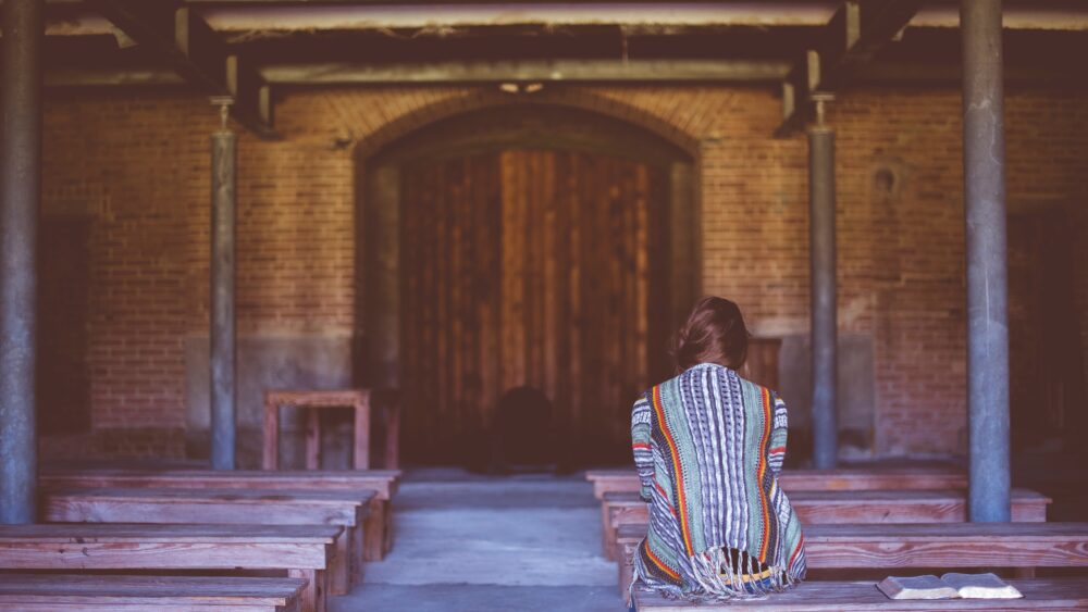 Woman in church alone