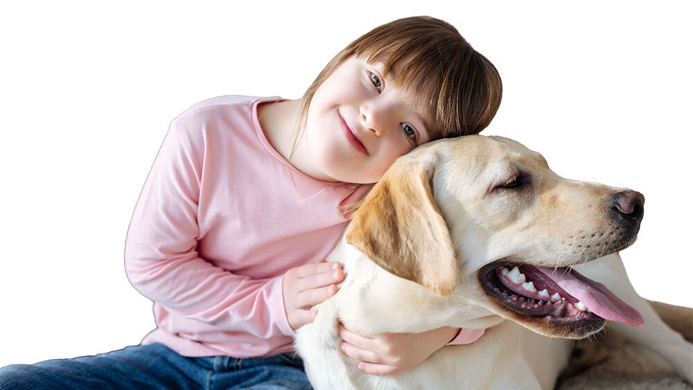 Child with down syndrome cuddling with dog