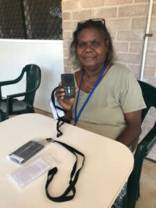 Wendy, holding a Megavoice player at the Kriol Workshop