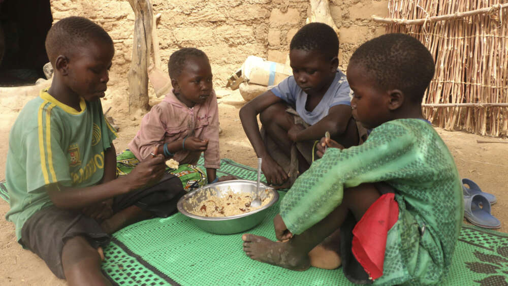 Doudou Ltanoua (not seen in photo) school aged-children enjoy a hot meal cooked with food items provided by World Food Programme /Cameroon, Koza, Far North region, 30 April 2020 Image: Glory Ndaka for World Food Programme