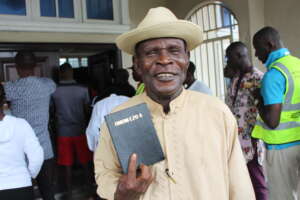 John Okolubo at Ogbia New Testament launch in Nigeria. Image: Bible Society Nigeria