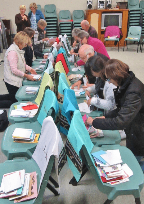 Sorting letters for inmates written by Kairos team members and supporters