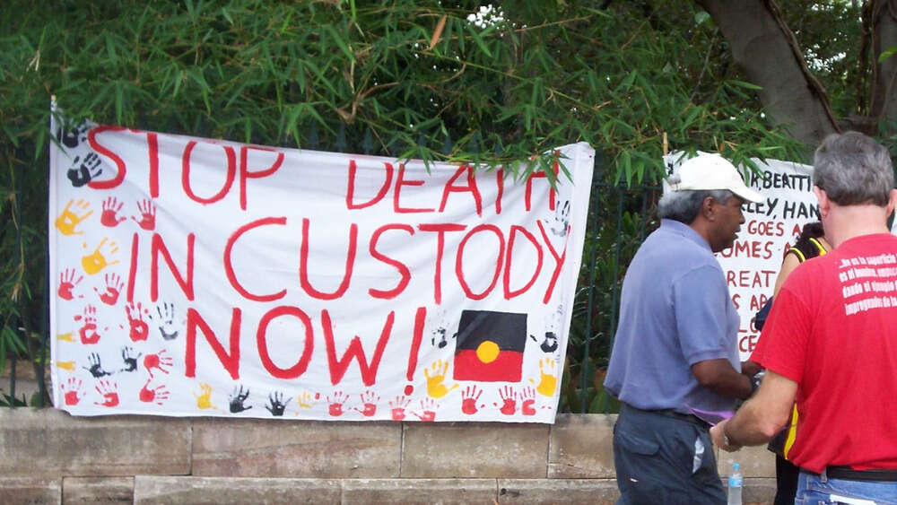 Stop Deaths in Custody Banner, Invasion Day Rally and March, Parliament House, George St, Brisbane, Queensland, Australia 070126. Image: David Jackmanson