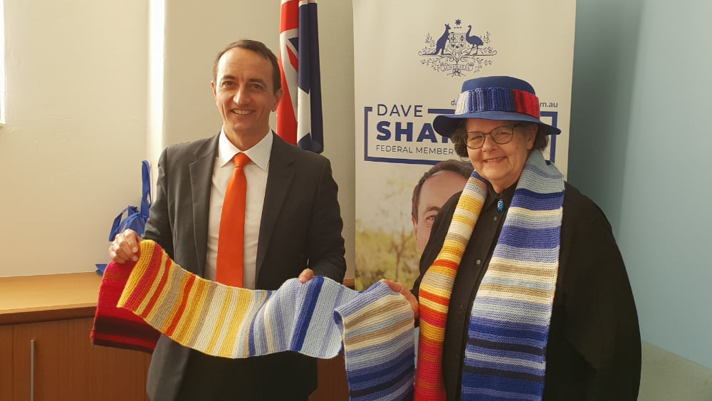 Dave Sharma, (Liberal) Member for Wentworth, NSW is presented with a climate stripe scarf