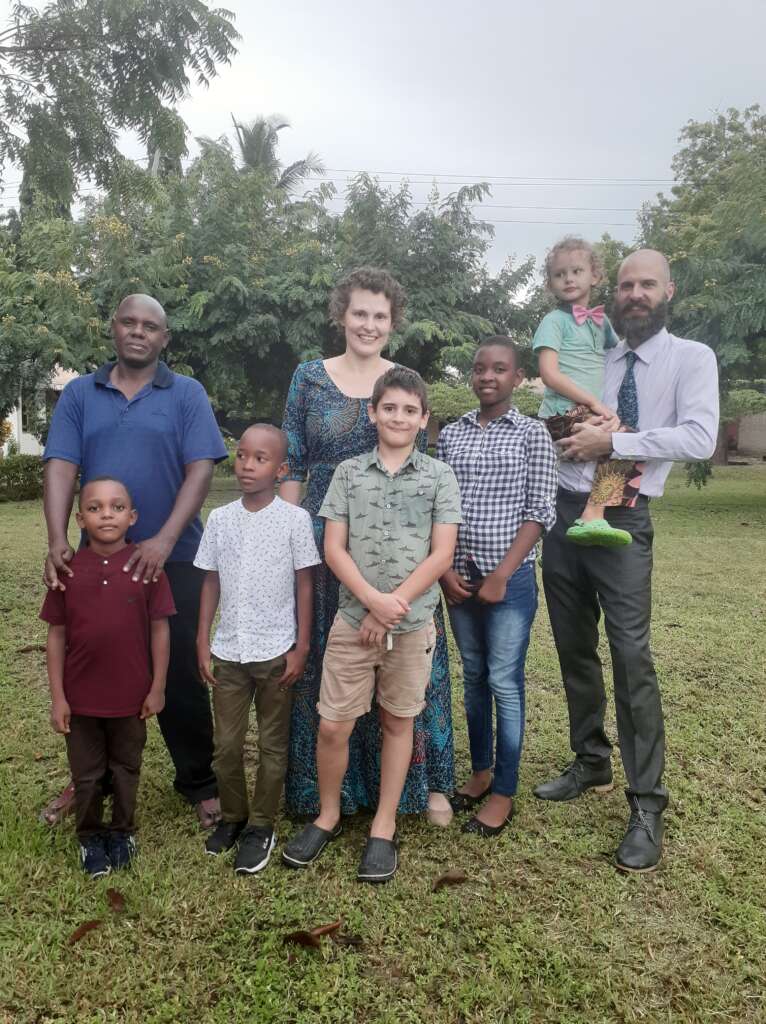 The Davis family with Eluid and his children