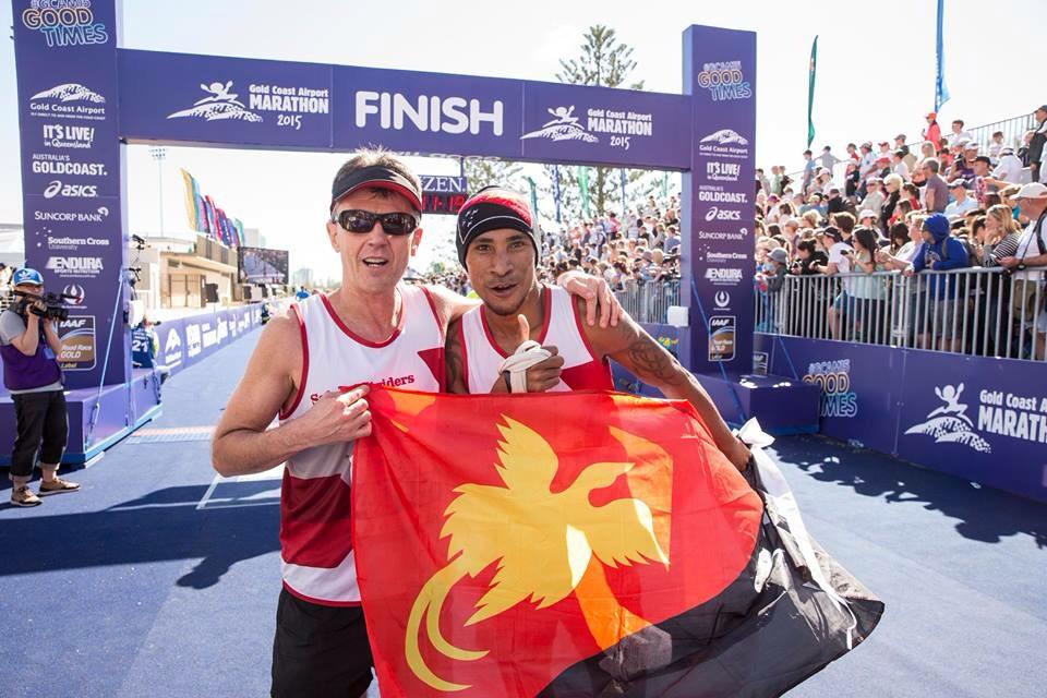 Bill Hunter completes the Gold Coast Marathon with a friend from PNG