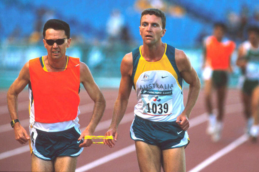 Bill Hunter guides Gerrard Gosens at the 2000 Paralympics