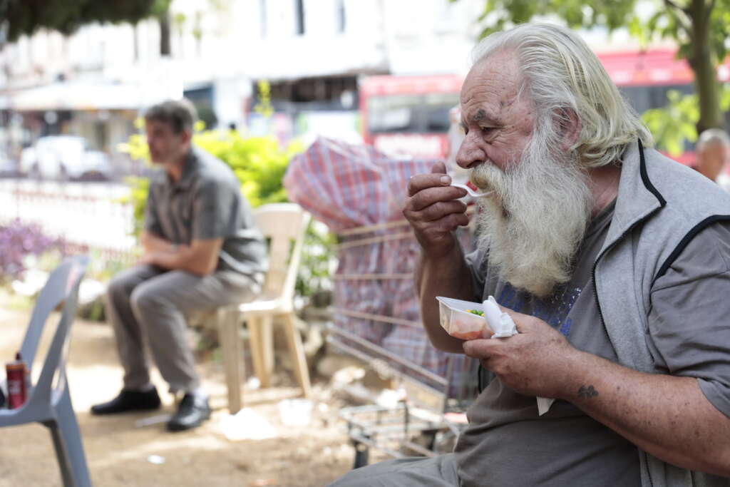 Man eating a free takeaway meal