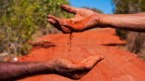 red earth and hands