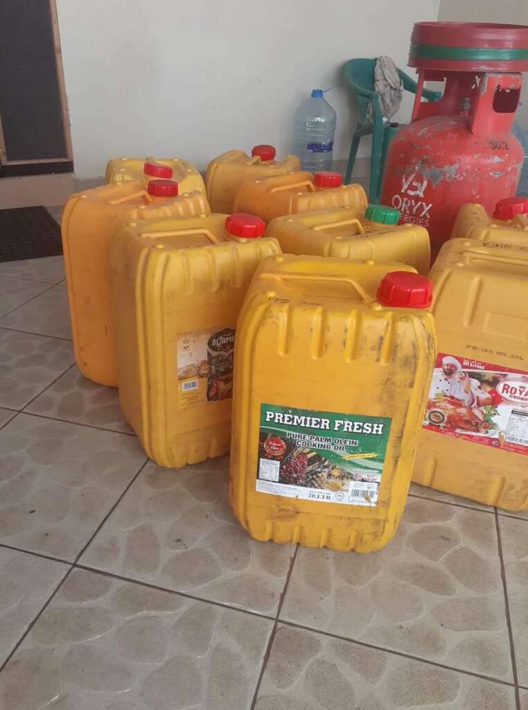 'Madumu' containers, formerly filled with palm oil, are used to transport water in Tanzania