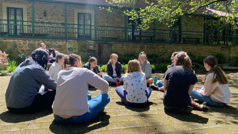 Girls in discussion at SQUAD Camp