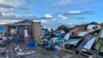 yphoon Odette leaves parts of Visayas and Mindanao with no water, electricity. Photos by Adonis Casinillo, World Vision.