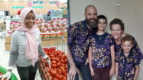 A Muslim supermarket worker; The Davis family in their matching Christmas outfits