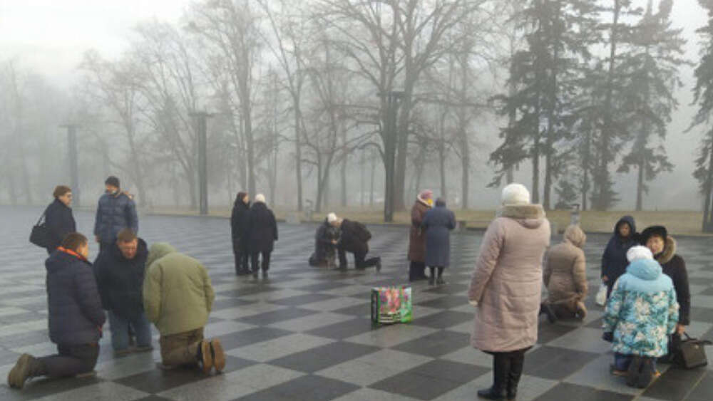 Local Christians gather at 7.30am every morning to pray for protection and peace in the central square of Kharkiv (30 km/19 miles to the Eastern border). Image: Rostyslav Stasyuk
