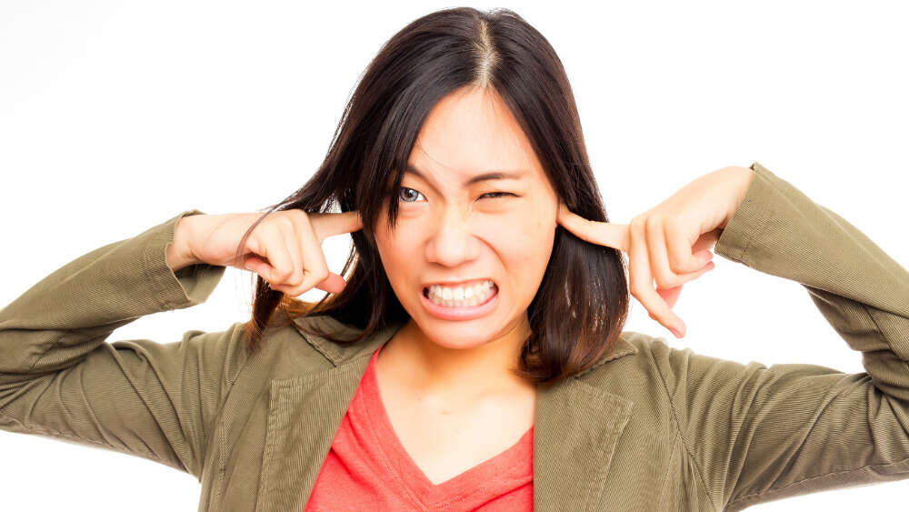 Woman blocking ears